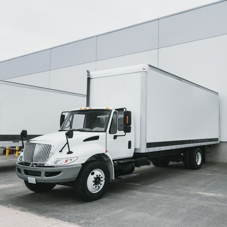 26ft box straight truck parked at a loading dock