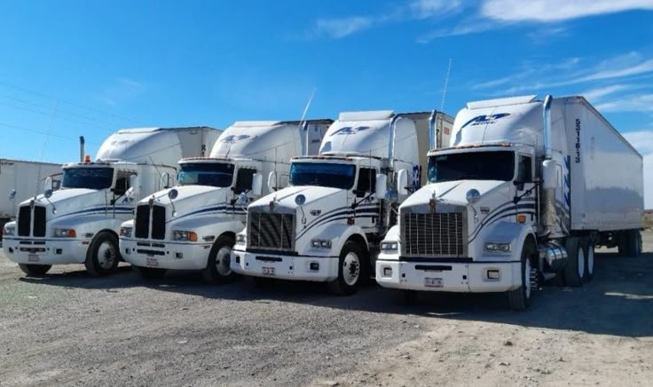 Fleet of semi trucks with dry van trailers